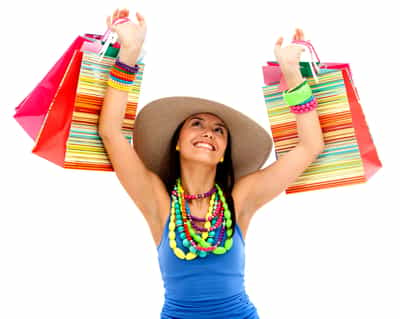 Beautiful shopping woman smiling and wearing a hat - isolated over white